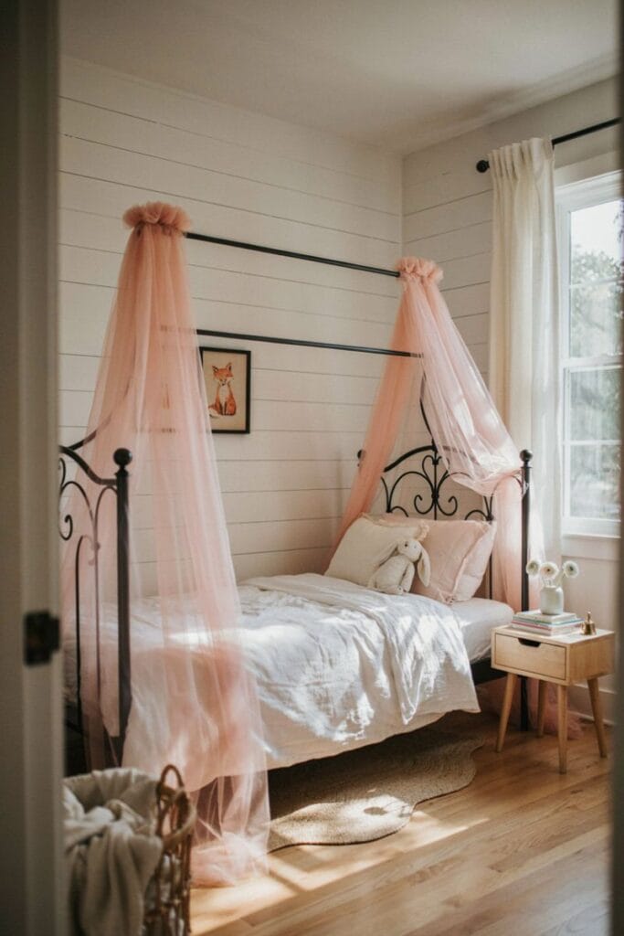 Black iron canopy with pink tulle black and pink toddler girl bedroom
